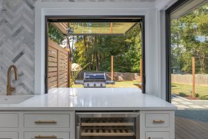 Tilt out window with fully extended counter top to connect the kitchen with the outside entertaining space.