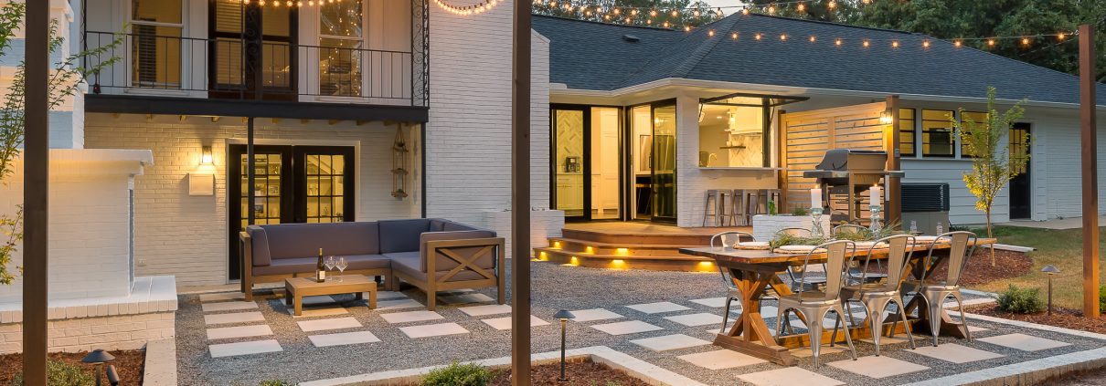 paver patio, string outdoor lighting, brick outdoor fireplace,