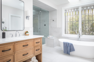 wood vanity in white bathroom