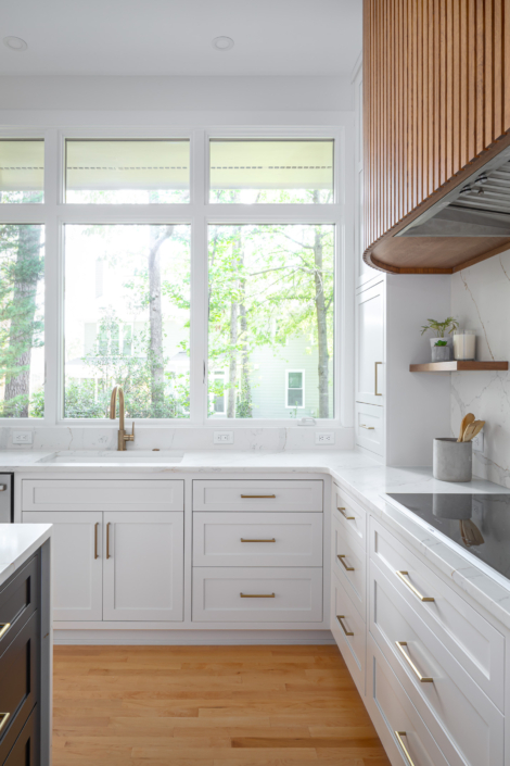 white kitchen with windows over sink