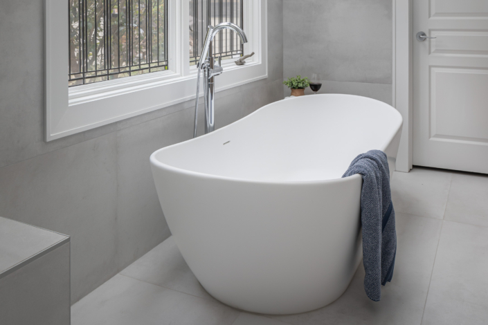 free standing tub in front of window