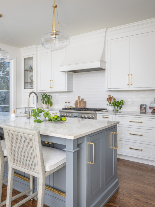 blue kitchen island and white cabinets