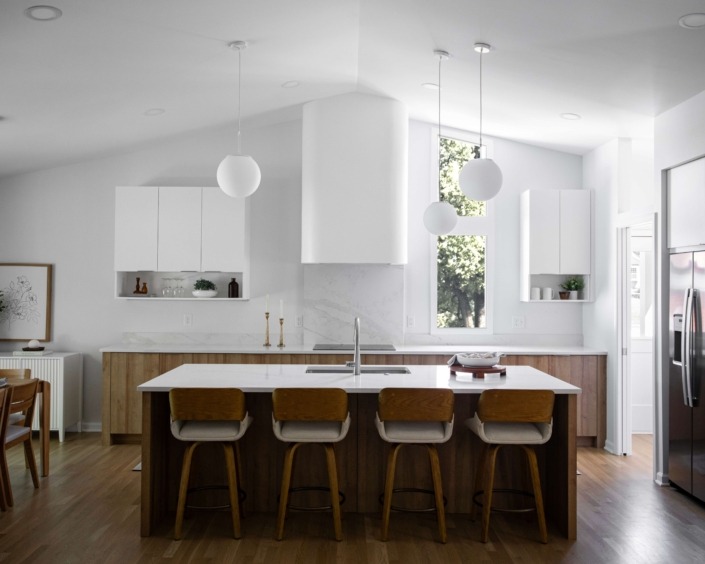 modern kitchen remodel in Raleigh NC with flat panel white upper cabinets and warm lower wood cabinets.