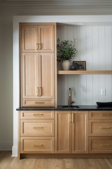 Wakefield_IMG_0018 Custom natural wood cabinetry with integrated storage, open shelving, and a built-in beverage station.